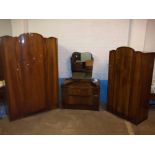 A MID CENTURY BOW FRONTED THREE PIECE BEDROOM SUITE WITH WARDROBES AND DRESSING TABLE