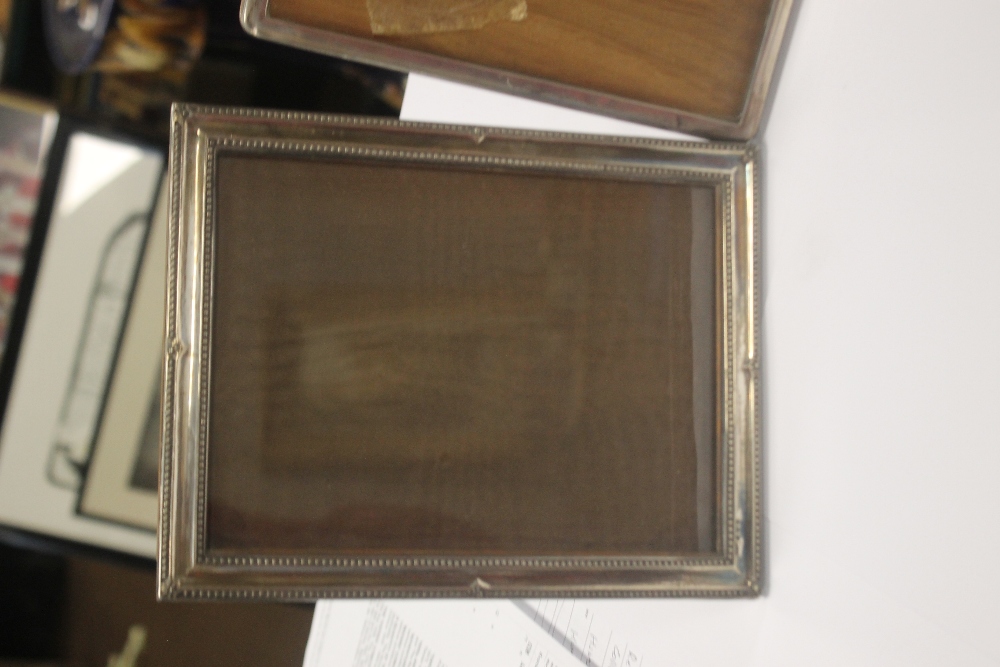 TWO HALLMARKED SILVER PICTURE FRAMES together with a white metal frame, the largest 23 x 17.5 cm - Image 2 of 3