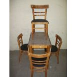 A VINTAGE DROP LEAF FORMICA KITCHEN TABLE AND FOUR CHAIRS