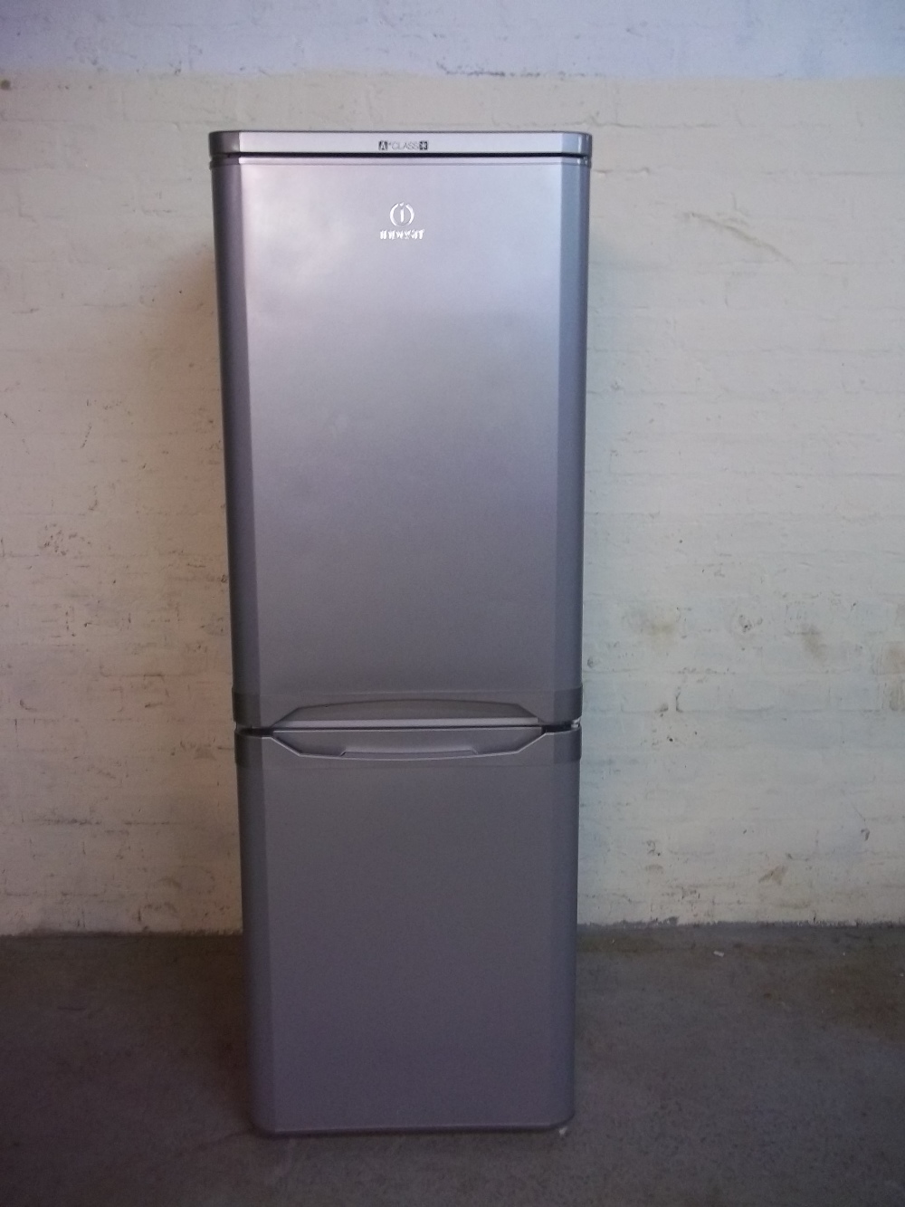 AN INDESIT FRIDGE FREEZER