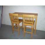 A HIGH BENCH DINING TABLE AND TWO TALL CHAIRS