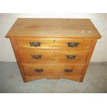 AN EDWARDIAN THREE DRAWER CHEST OF DRAWERS