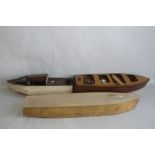 THREE VINTAGE FIBRE GLASS AND WOOD BOATS AND STANDS, 76 cm, 63 cn, and 90 cm