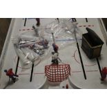 A TABLE TOP ICE HOCKEY GAME TOGETHER WITH A BOXED MICRO SUPER ENDURANCE SCALEXTRIC