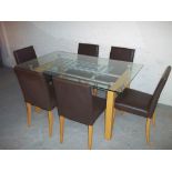 A GLASS DINING SET WITH SIX FAUX LEATHER CHAIRS