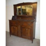 AN ANTIQUE OAK MIRROR BACKED WALL UNIT / SIDEBOARD