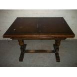 AN OAK VINTAGE DRAWER LEAF TABLE