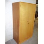 A LIGHT OAK WARDROBE