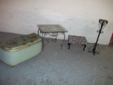 A WICKER KRAFT LOOM STYLE BLANKET CHEST, A FOOTSTOOL, A GLASS SIDE TABLE, A WROUGHT IRON STAND AND