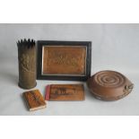 A SMALL BOX OF COLLECTABLES to include a shell case vase, a copper warmer, a framed metal plaque