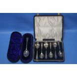 A CASED SET OF HALLMARKED SILVER TEASPOONS together with another cased spoon