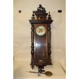 A LARGE WALL CLOCK WITH CARVED HORSE MOUNT