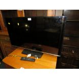 A SAMSUNG 31" FLATSCREEN TV WITH REMOTE - HOUSE CLEARANCE