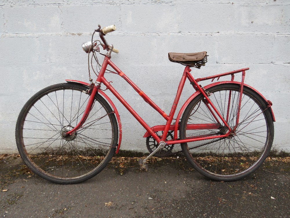 A VINTAGE 1950s THREE SPEED TRIUMPH LADIES BICYCLE PAINTED RED