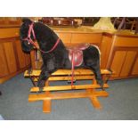 A CHILDS TRESTLE BASE ROCKING HORSE