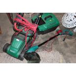 AN ELECTRIC QUALCAST LAWNMOWER TOGETHER WITH A BOSCH ELECTRIC STRIMMER