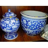 AN ORIENTAL STYLE BLUE AND WHITE JARDINIERE AND A LARGE BLUE AND WHITE GINGER JAR