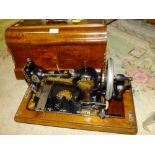 A VINTAGE CASED JONES FAMILY CS QUEEN ALEXANDRA SEWING MACHINE