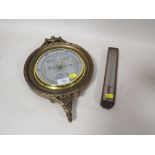 A CIRCULAR WALL MOUNTED BAROMETER TOGETHER WITH A SMALL WOODEN CASED THERMOMETER