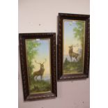 A PAIR OF OAK FRAMED AND GLAZED WATERCOLOURS OF STAGS - OVERALL SIZE 83CM X 42.5CM