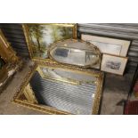 TWO GILT FRAMED WALL MIRRORS TOGETHER WITH A GILT FRAMED OIL ON CANVAS OF A WOODLAND RIVER SCENE,