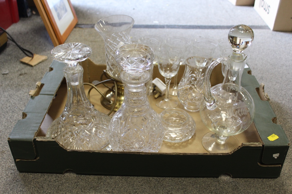 A TRAY OF CUT GLASS TO INCLUDE AN EDWARDIAN STYLE SIX PERSON DRINK SET, DECANTERS ETC.