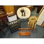 A WHITE SWIVEL CHAIR, WINE RACKS, BASKETS ETC.