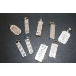 A SELECTION OF SILVER INGOT PENDANTS - APPROX 80.8 G