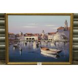 A GILT FRAMED OIL ON BOARD OF A CONTINENTAL HARBOUR SCENE WITH MOORED BOATS, SIGNED LOWER RIGHT, H
