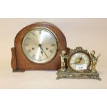 A SMALL GILT METAL DESK CLOCK TOGETHER WITH AN OAK MANTEL CLOCK