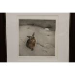 A FRAMED AND GLAZED ORIGINAL ETCHING OF A HARE IN A MOONLIT SNOWY LANDSCAPE SIGNED LOWER RIGHT,