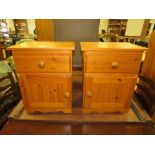 A PAIR OF PINE BEDSIDE CABINETS