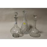 TWO CUT GLASS DECANTERS TOGETHER WITH AN ANTIQUE ETCHED GLASS DECANTER
