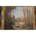 A GILT FRAMED OIL ON CANVAS OF A MOUNTAINOUS WOODED LANDSCAPE - OVERALL SIZE - 66CM X 75CM
