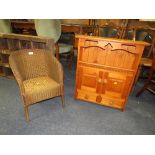 A SMALL CHILDS LLOYD LOOM ARMCHAIR AND A PINE RACK