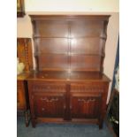 A 20TH CENTURY OAK DRESSER WITH PLATE RACK - W 126 CM