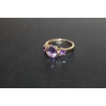 A HALLMARKED 9 CARAT GOLD THREE STONE AMETHYST RING, APPROX WEIGHT 2.2G