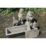 A SMALL RECTANGULAR PLANTER WITH FOUR SMALL GARDEN FIGURES ETC