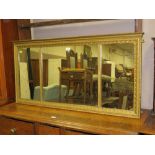 AN ANTIQUE GILT TRYPTCH OVERMANTEL MIRROR, W 129 CM