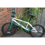A GREEN AND WHITE BMX