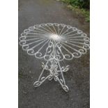 A WHITE PAINTED METAL GARDEN TABLE