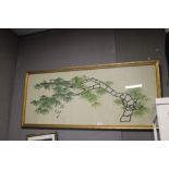 A FRAMED AND GLAZED ORIENTAL STYLE EMBROIDERED PICTURE