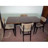 AN EXTENDING SAPPELE DINING TABLE AND FOUR CHAIRS