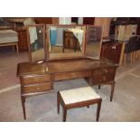 A STAG MINSTREL TRIPLE MIRROR DRESSING TABLE AND STOOL
