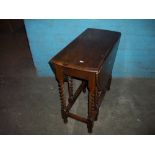 A BARLEY TWIST DROP LEAF TABLE