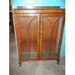 A VINTAGE GLAZED DISPLAY BOOKCASE WITH QUEEN ANNE LEGS