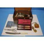 A MAHOGANY BOX OF COLLECTABLES, to include grape scissors, silver handle cake slice etc