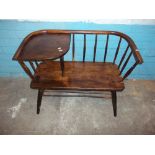 A WOODEN VINTAGE TELEPHONE BENCH SEAT IN THE STYLE OF ERCOL
