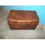 AN ANTIQUE METAL TRAVEL TRUNK