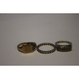 A WHITE METAL ETERNITY RING SET WITH WHITE STONES MARKED 9CT AND A 9CT GOLD SIGNET RING A/F TOGETHER